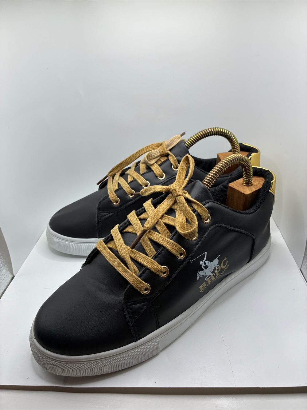 RHPC BEVERLY HILLS POLLO CLUB WOMANS SNEAKER/ SIZE 8. BLACK AND GOLD LACE FRONT